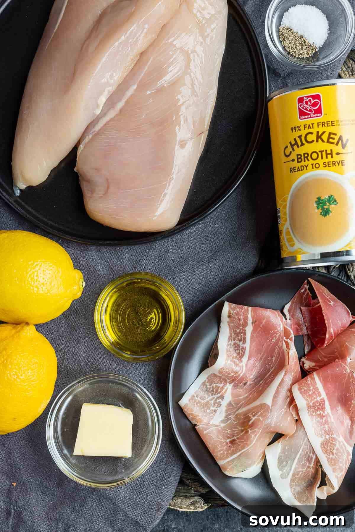 Ingredients for preparing Prosciutto Wrapped Chicken, neatly laid out on a kitchen counter.