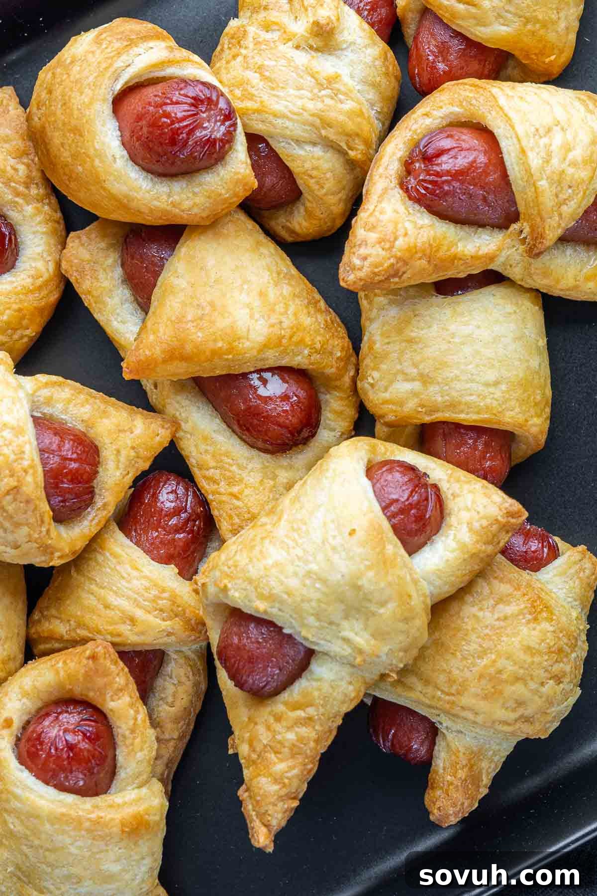 Air Fryer Pigs in a Blanket on a black plate