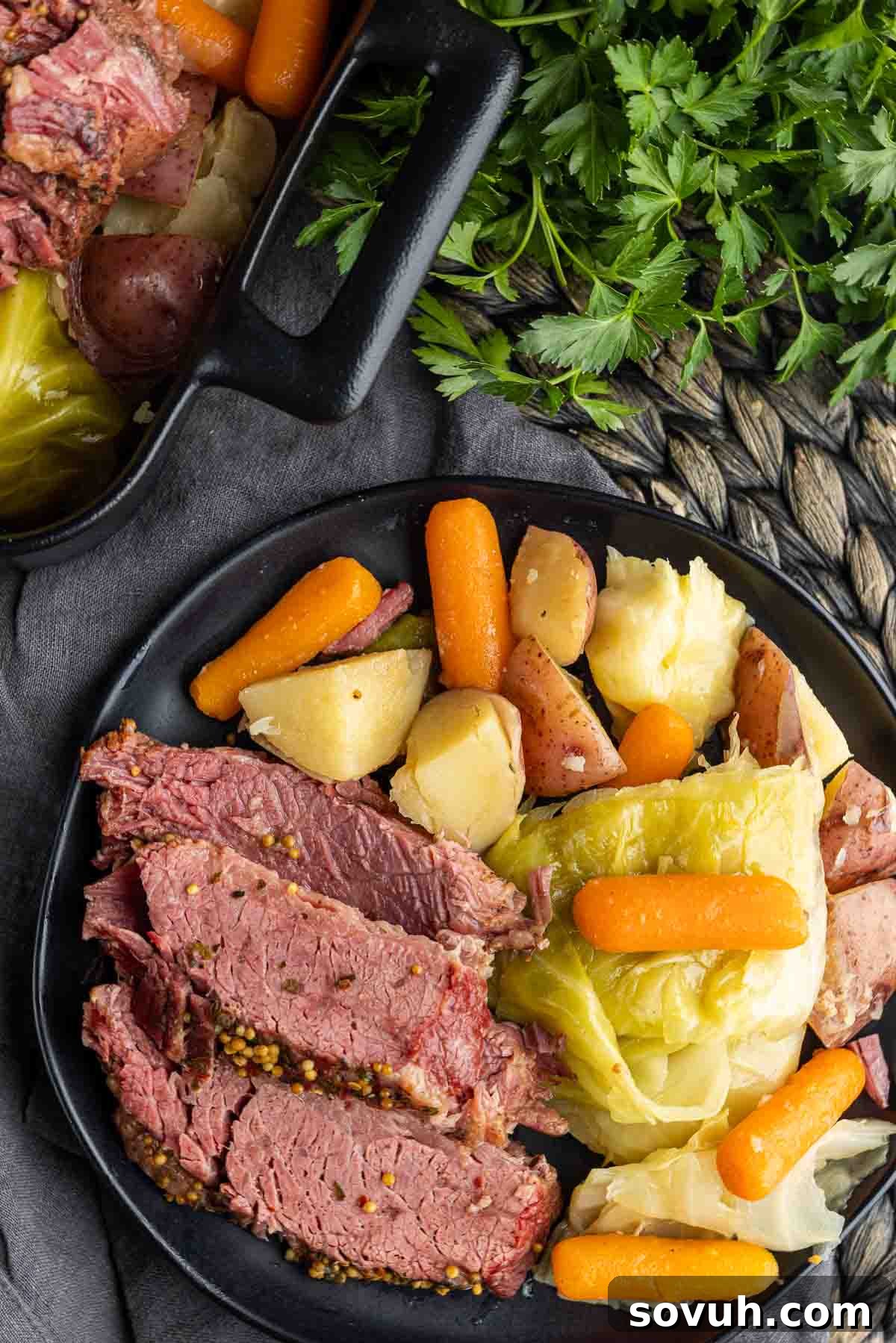 A plated serving of tender Instant Pot Corned Beef, accompanied by perfectly cooked cabbage wedges, showcasing the delicious meal.