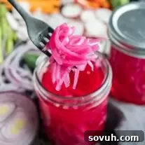 Pickled Red Onions on a fork