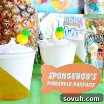 Delightful Pineapple Jell-O Parfaits, made with Capri Sun Roarin' Waters, perfect for a kids' party dessert.