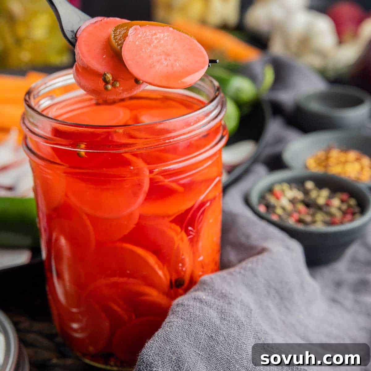 sliced Pickled Radishes on a fork