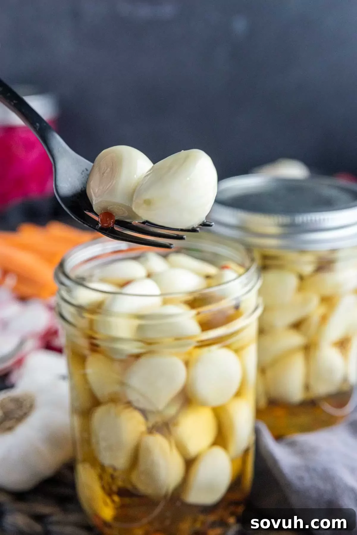 Pickled Garlic on a black fork