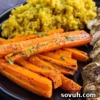 Hot Honey Roasted Carrots on a black plate