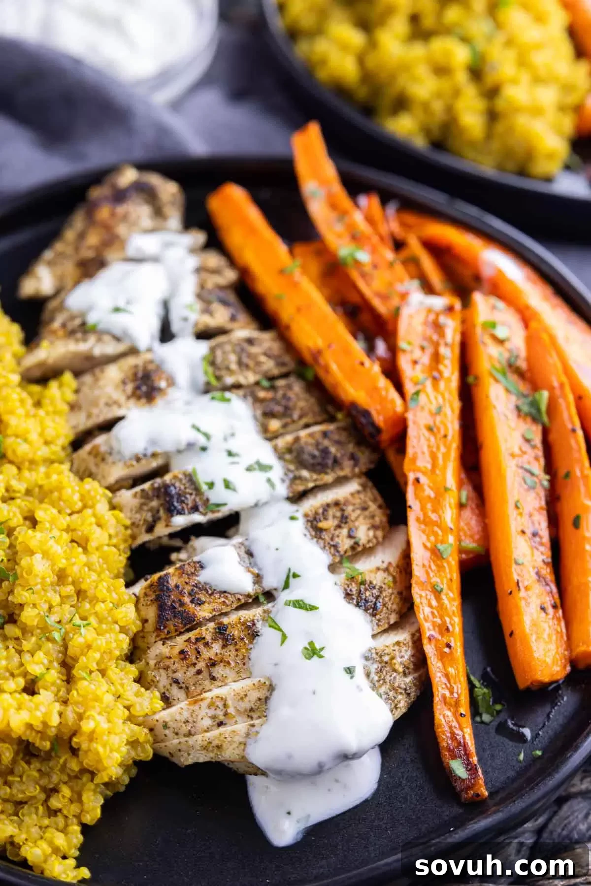 sliced Za’atar Chicken on a black plate