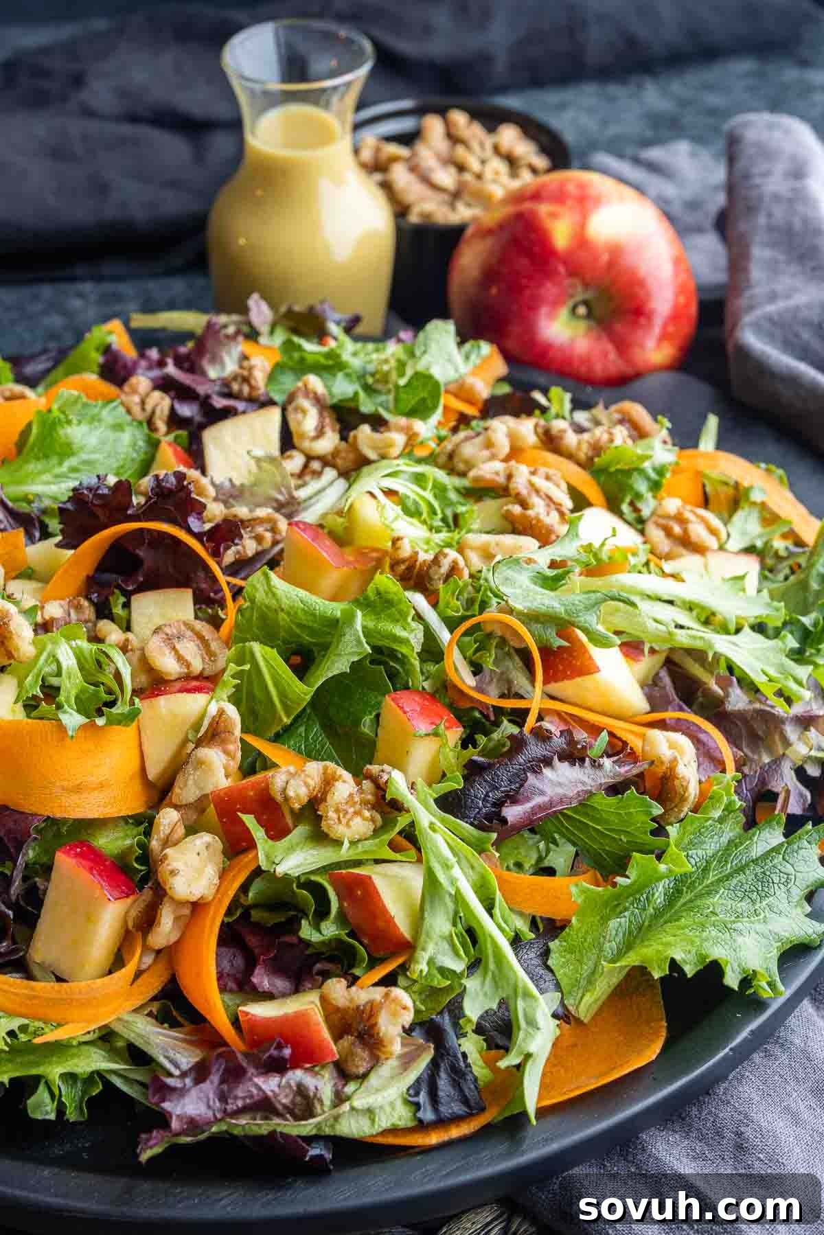 black platter of Apple Walnut Salad
