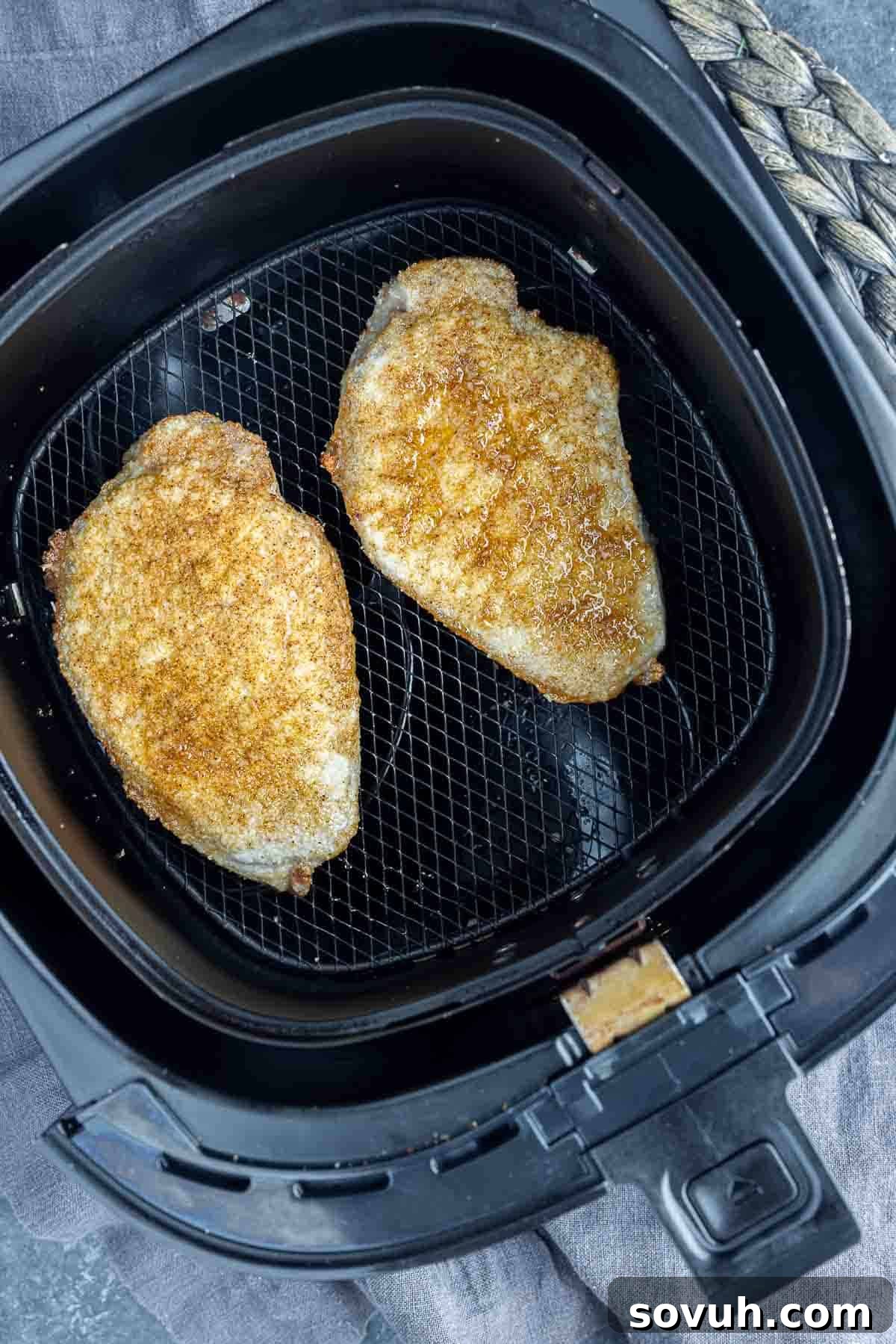 Air Fryer Honey Garlic Pork Chops in air fryer basket