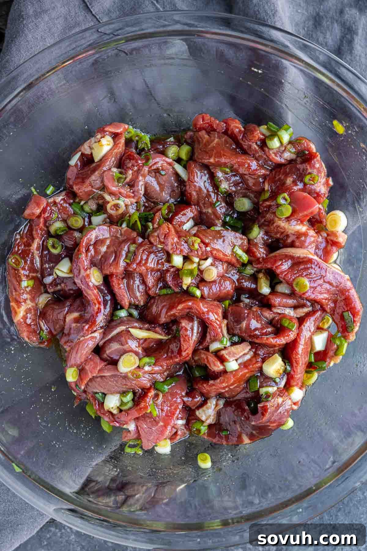glass bowl of Beef Bulgogi in a marinade