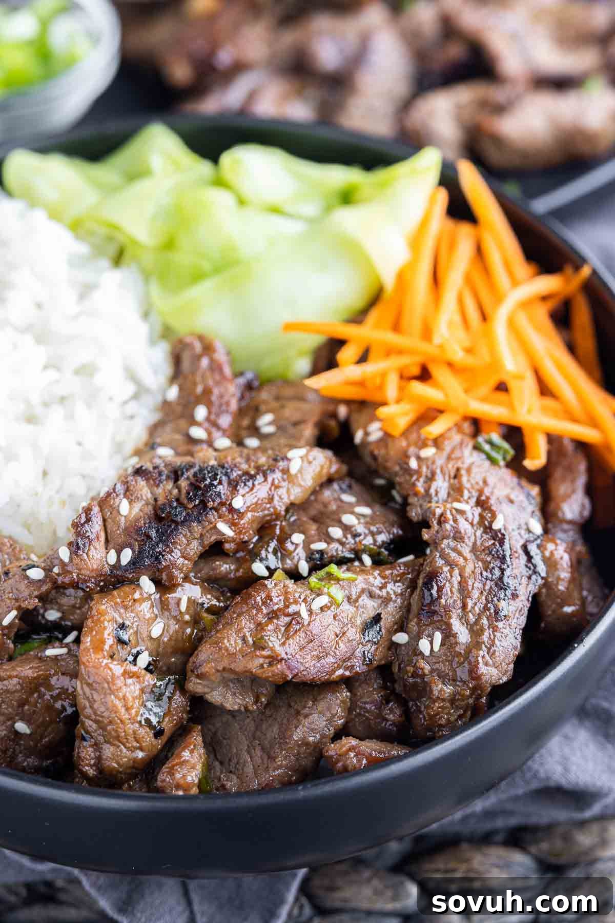 Beef Bulgogi in a black bowl with rice