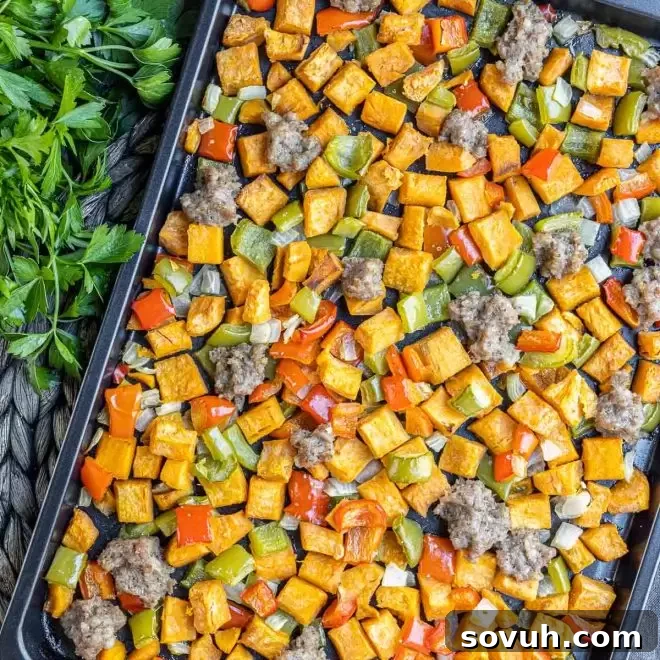Sweet Potato Hash with colorful peppers and savory sausage, a healthy and delicious breakfast option.