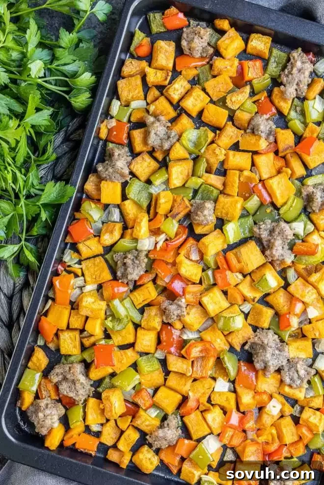 Complete Sweet Potato Hash meal on a sheet pan, ready to be served.
