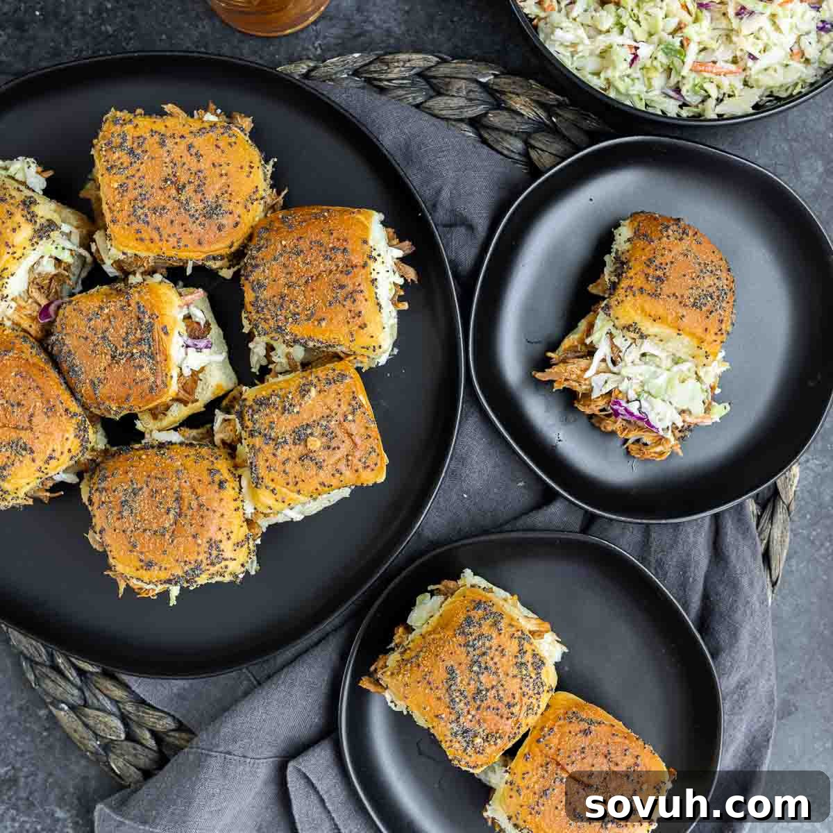 Platter of BBQ Pulled Pork Sliders, some on a plate, ready for a party or meal