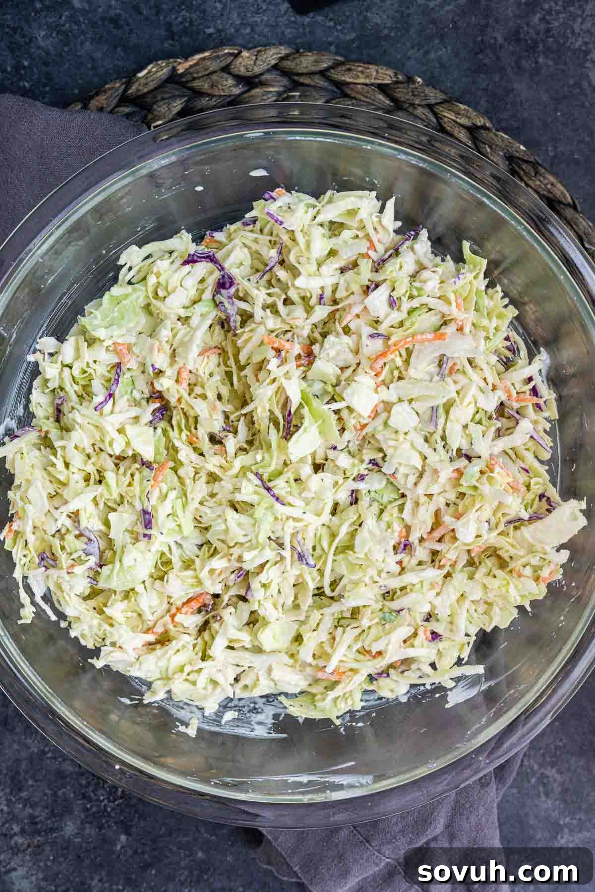 Glass bowl filled with freshly made Southern Coleslaw, ready to be chilled