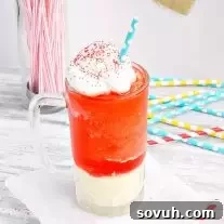 Finished Kool-Aid Slushie Ice Cream Float in a glass, ready for serving.