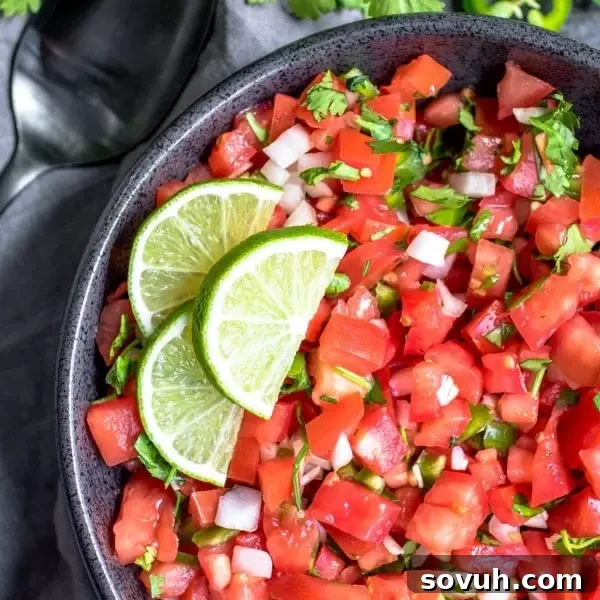 Fresh Pico de Gallo, or Salsa Fresca, with lime slices on top