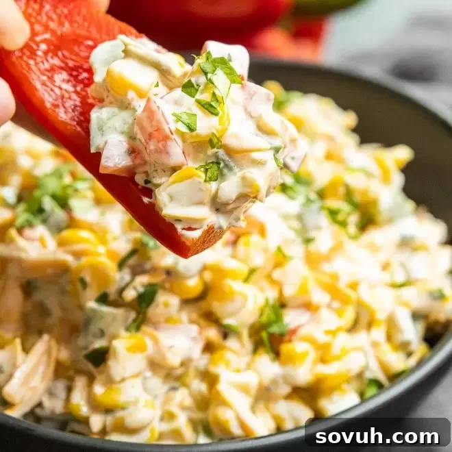 Red pepper slice topped with creamy Jalapeno Corn Dip