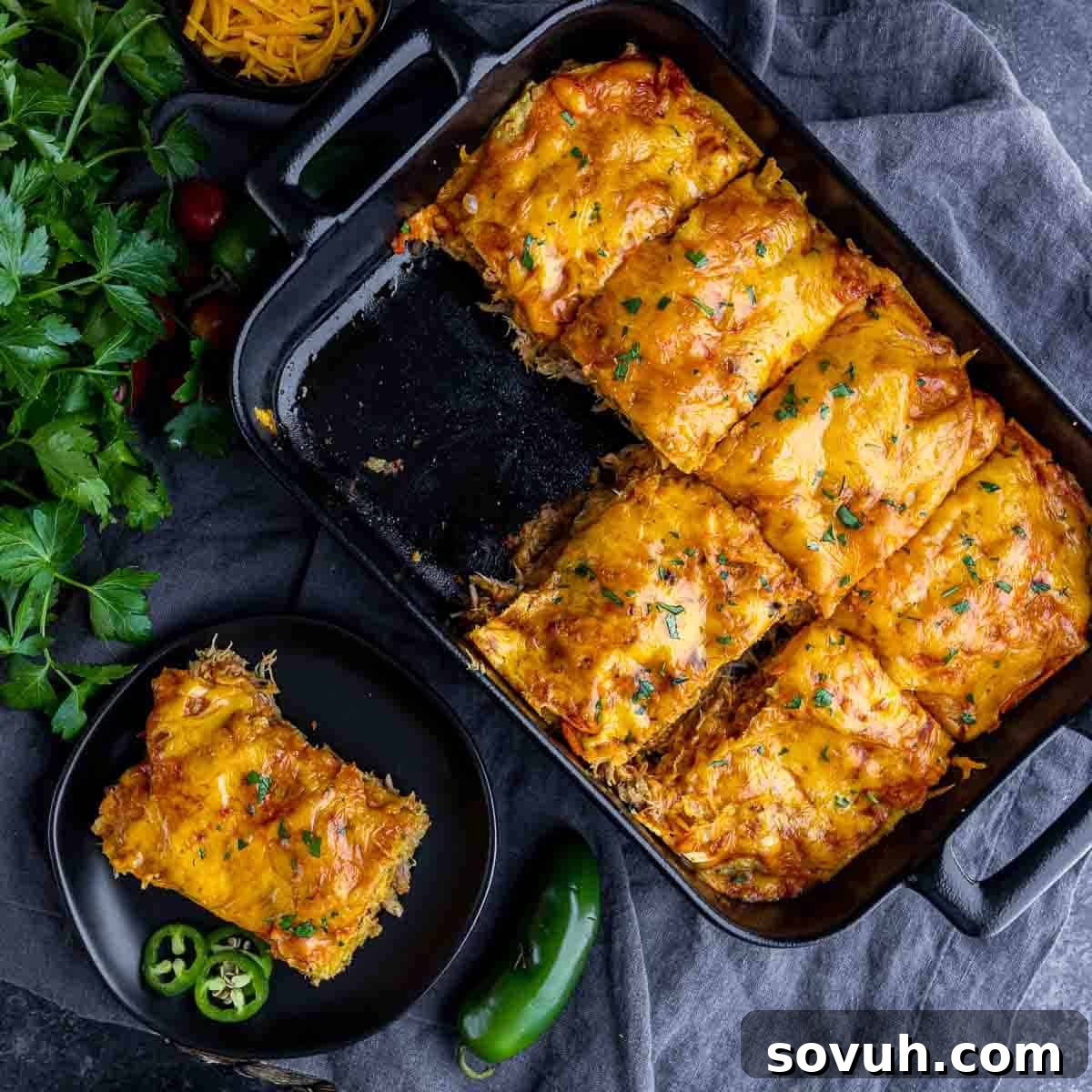 Delicious Pulled Pork Enchilada Casserole, portioned in a baking dish, ready to serve.