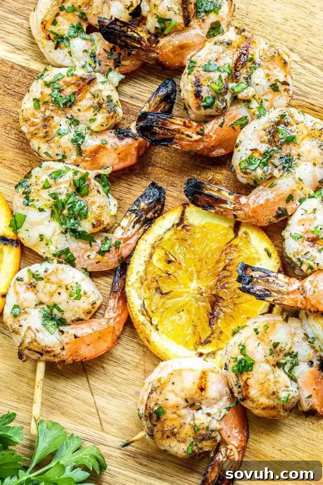 Grilled Citrus Marinated Shrimp served with fresh grilled lemon slices for an extra burst of flavor.