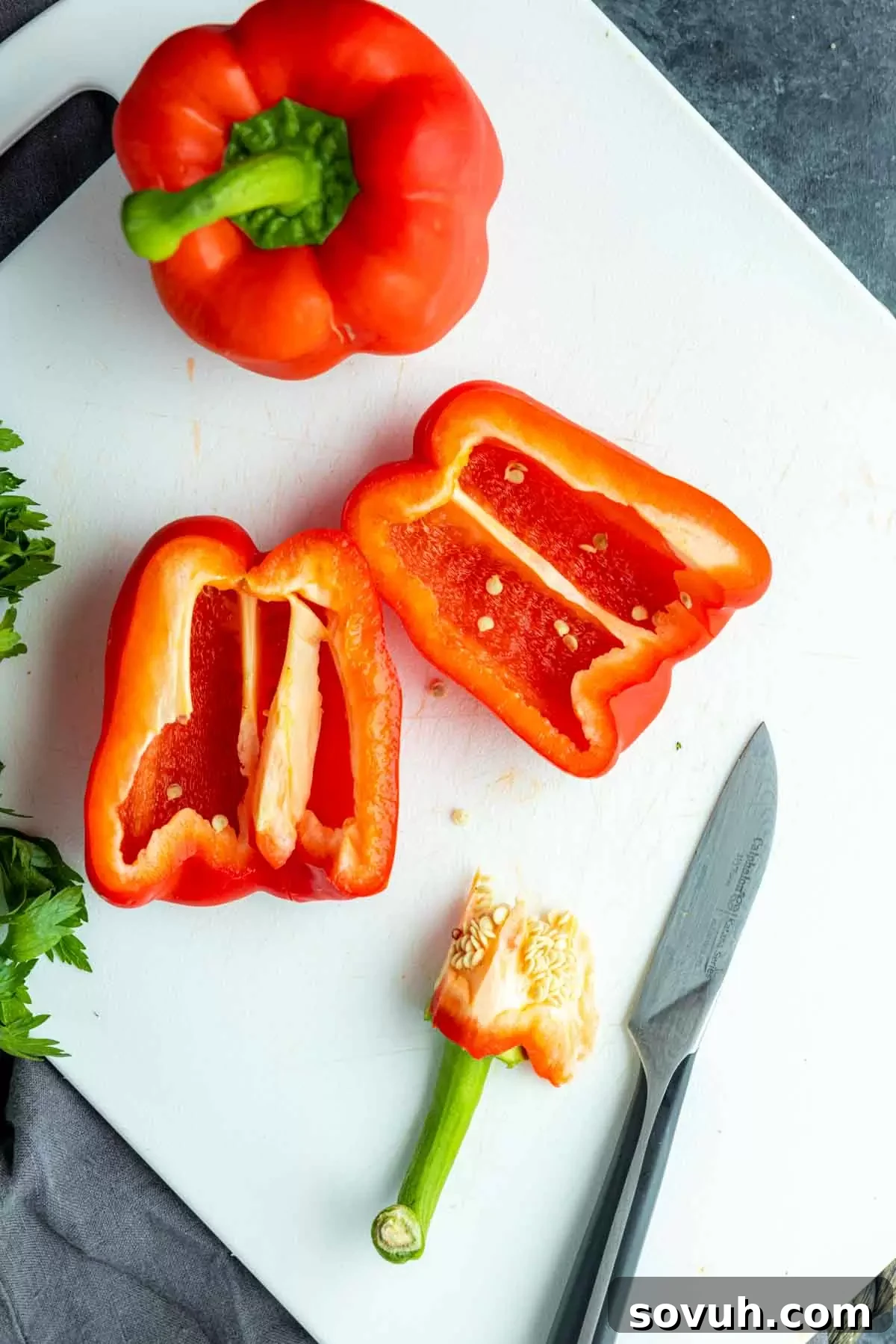 Close-up of a perfectly cut red bell pepper, showcasing its vibrant interior before the roasting process, highlighting freshness