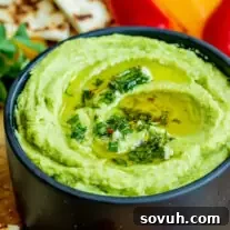 a black bowl of Avocado Hummus