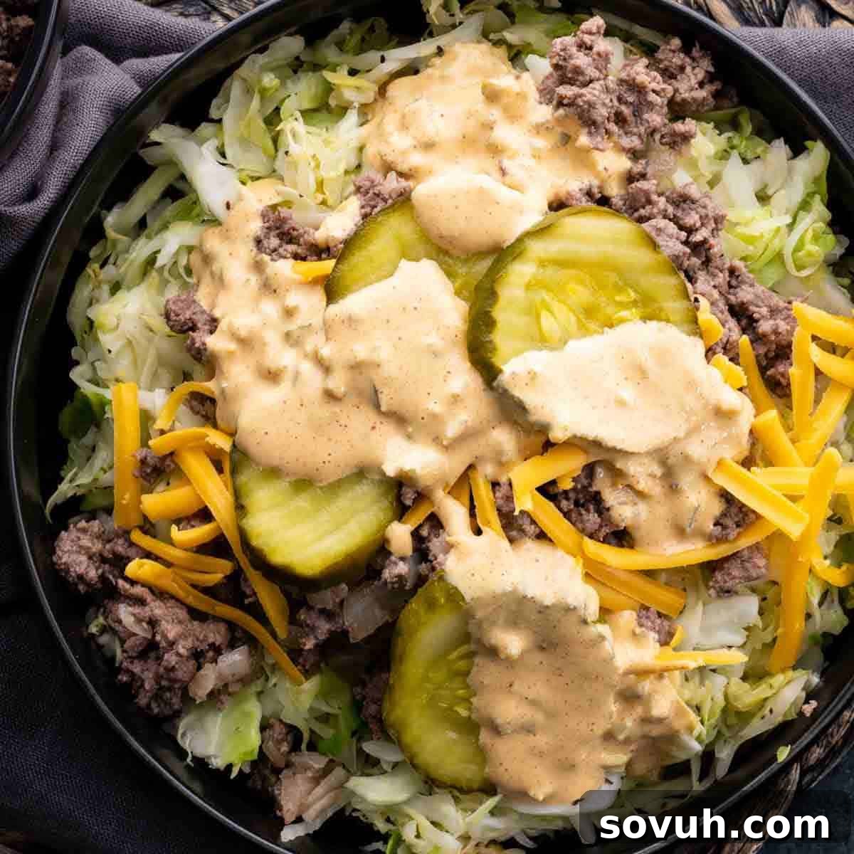 Top-down shot of a delicious keto Big Mac sauce on a Big Mac salad