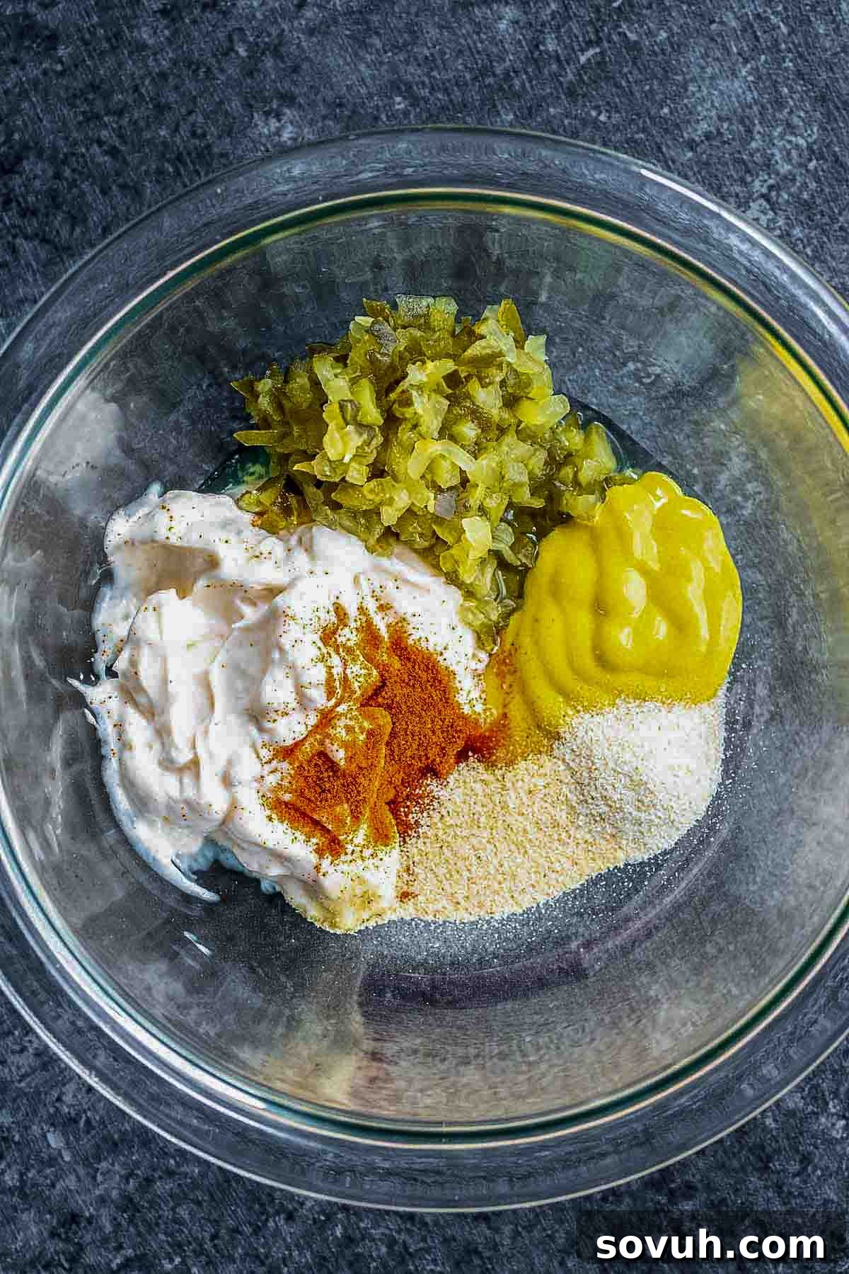 All ingredients for Keto Big Mac Sauce combined in a bowl, ready to be whisked