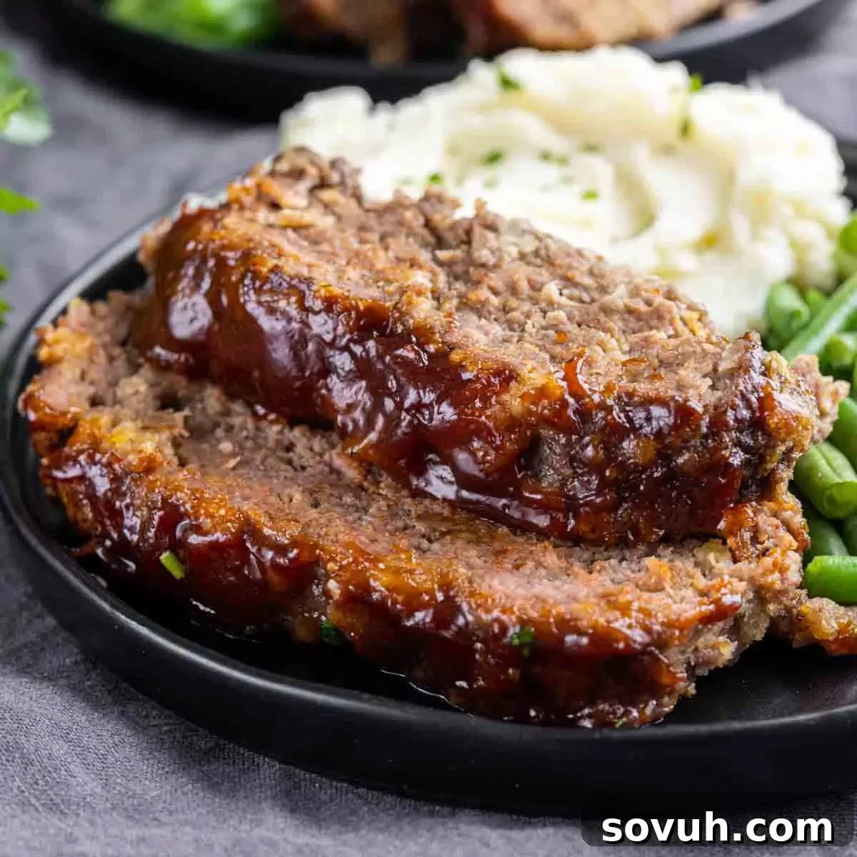 Perfectly baked easy meatloaf on a plate, ready to serve
