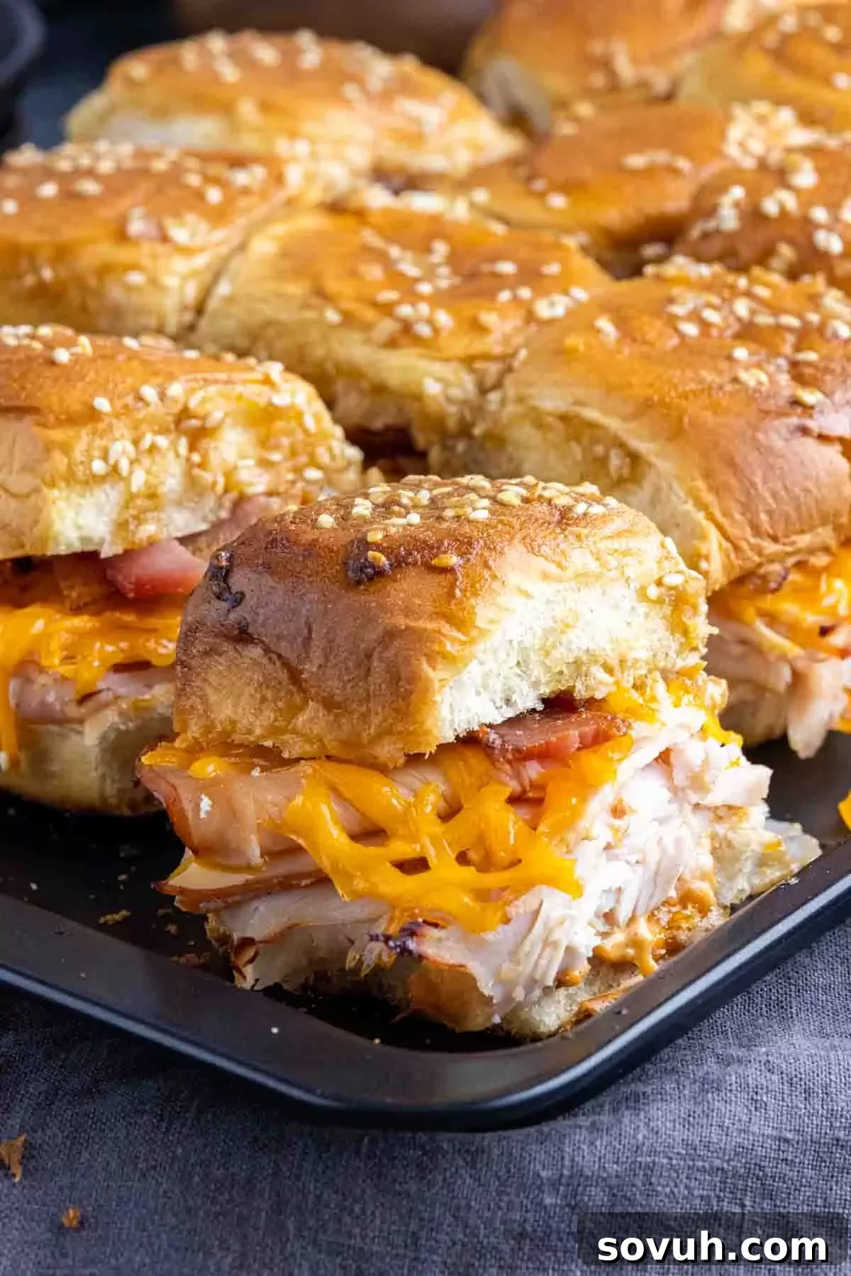 Baked Turkey Sliders arranged on a serving tray, ready for a party.