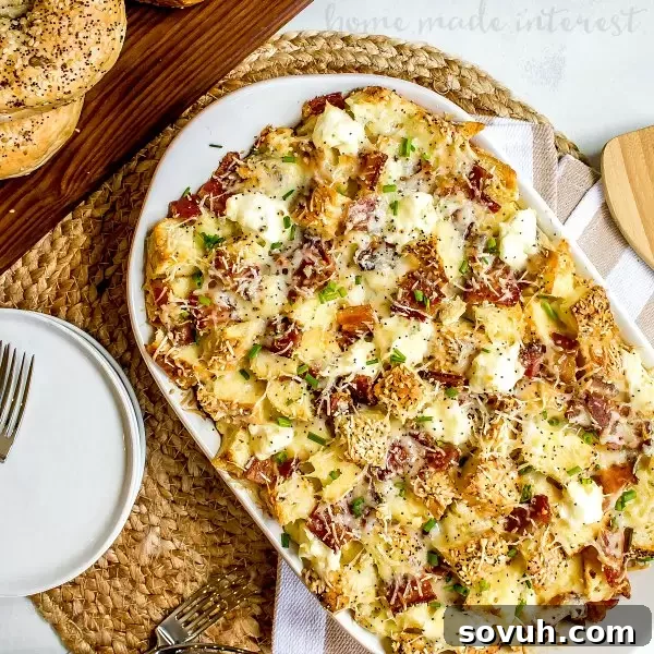 everything bagel casserole made with bacon and cheese, garnished with fresh chives