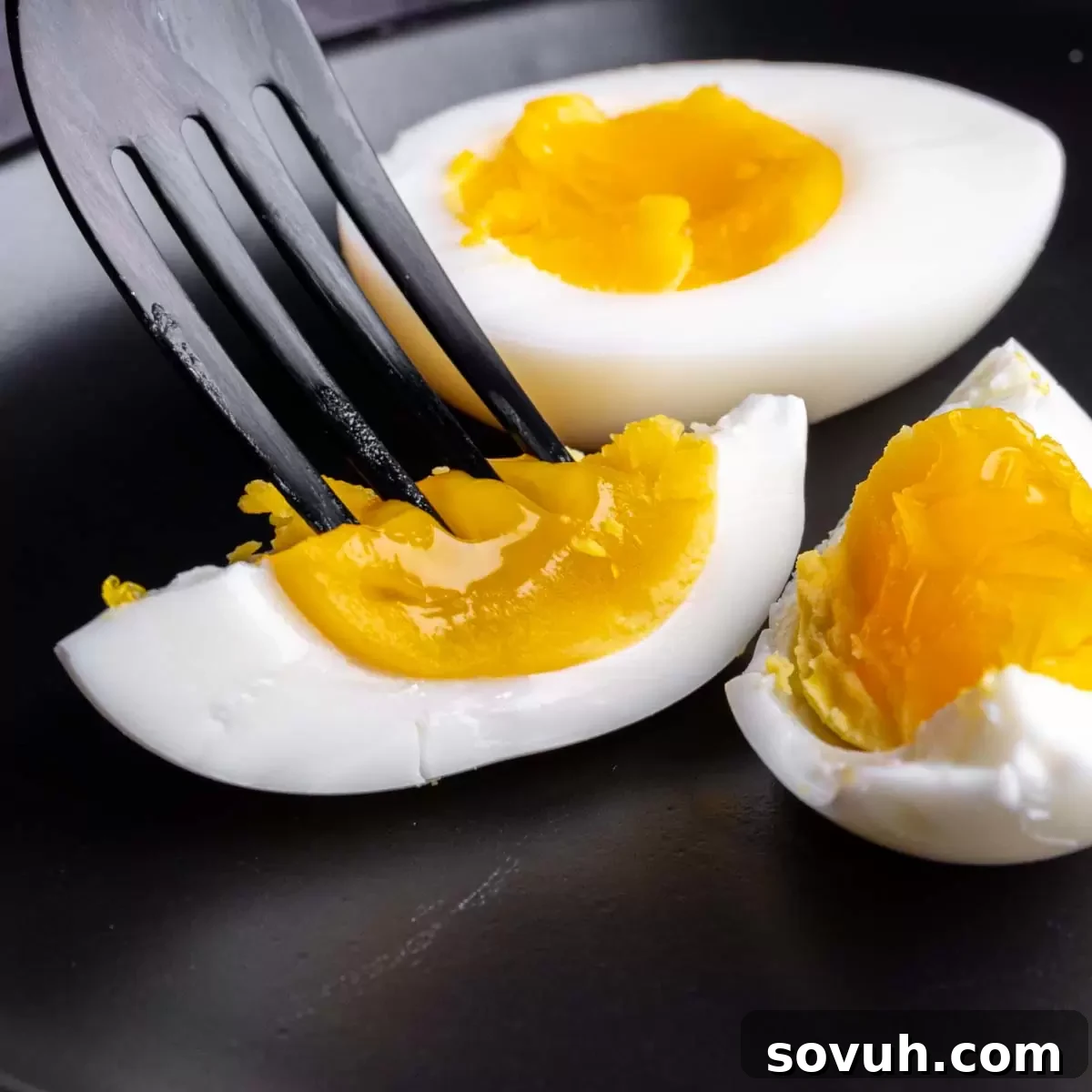 medium boiled egg with fork