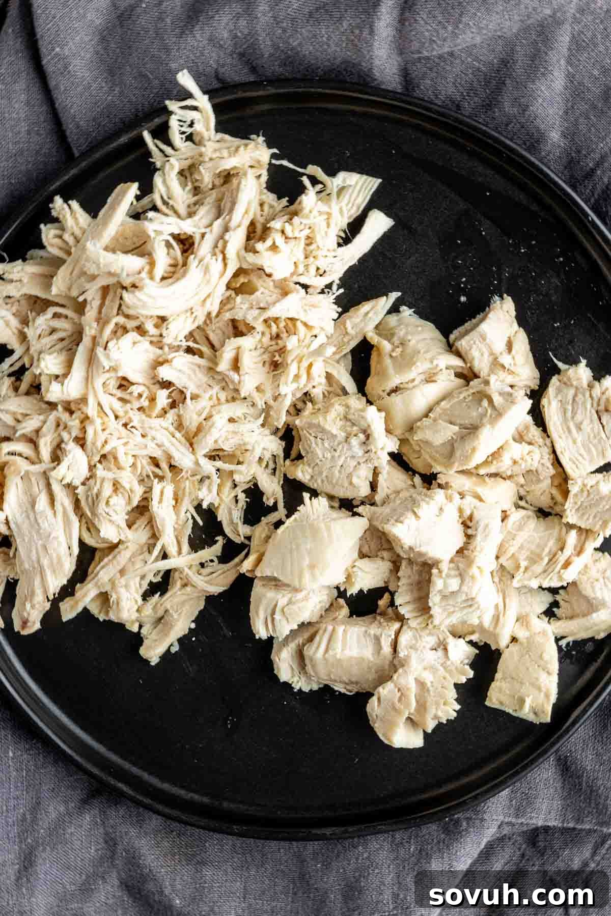 shredded and cubed chicken on a plate