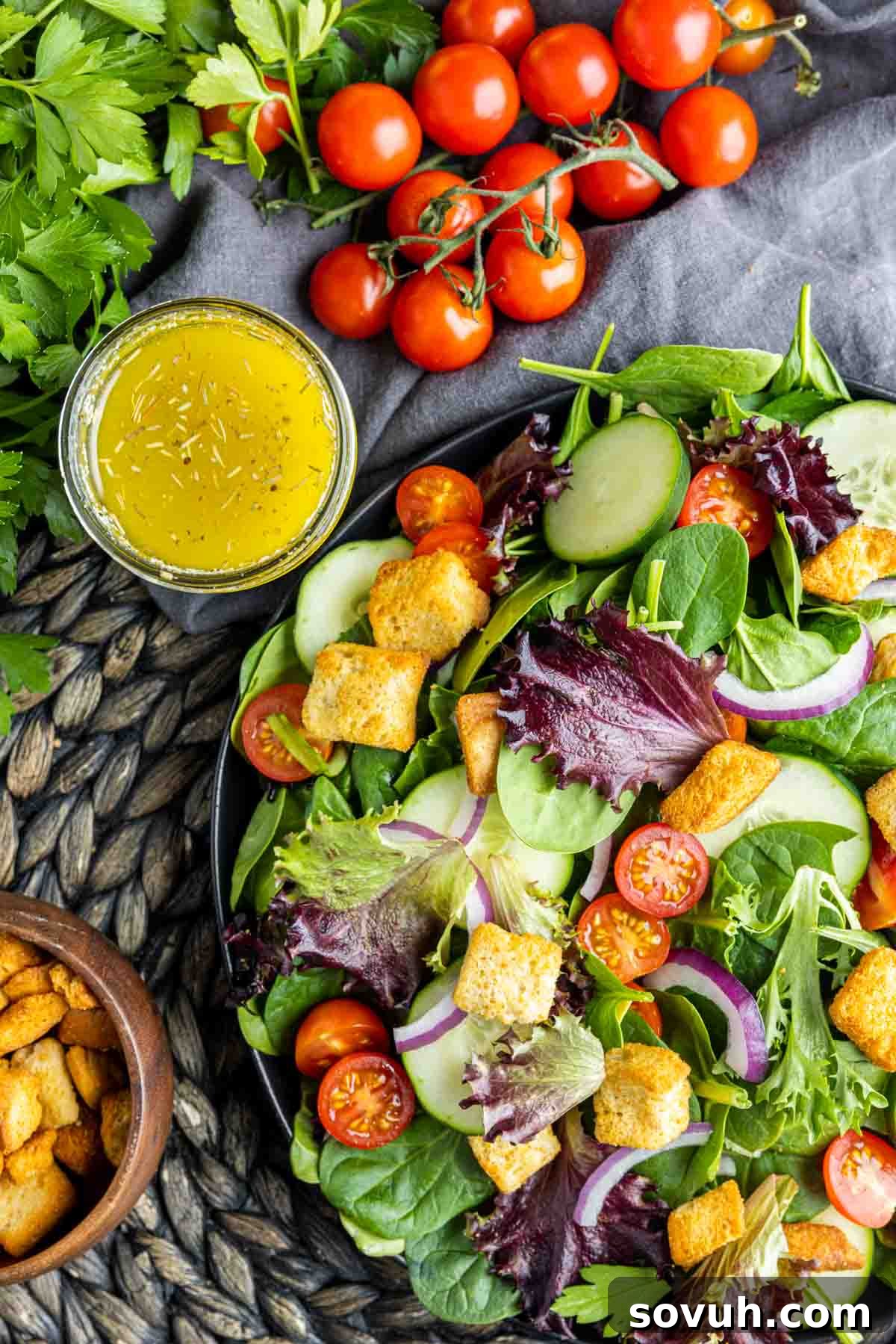 mixed green salad and homemade Italian dressing, ready to be combined