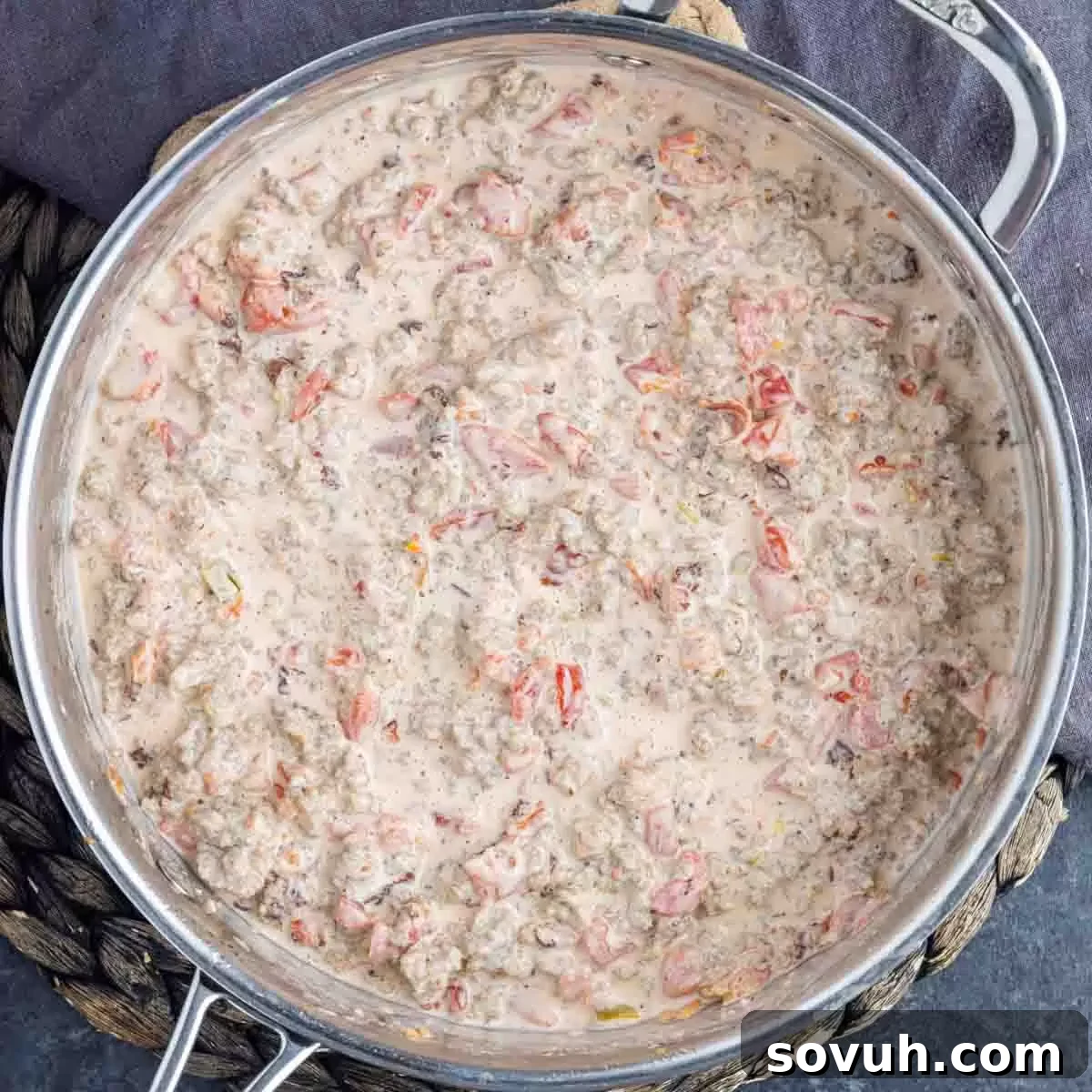 A skillet filled with warm, creamy Sausage Cream Cheese Dip, perfectly melted and ready to serve.