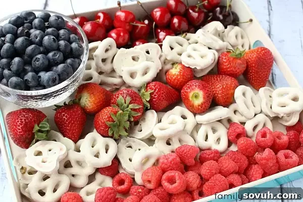 DIY American Flag Mason Jars for Fourth of July decor. Use as vases, utensil holders, or hostess gifts.