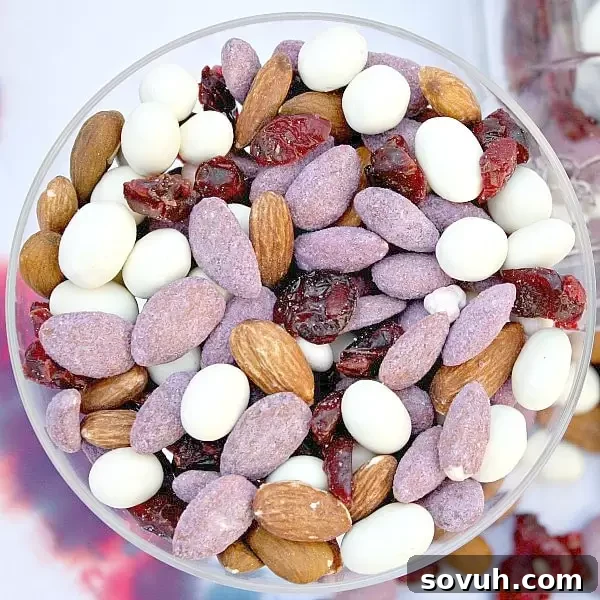 Individual red, white, and blue cupcakes in a jar. A refreshing and portable Fourth of July dessert with fruit layers.