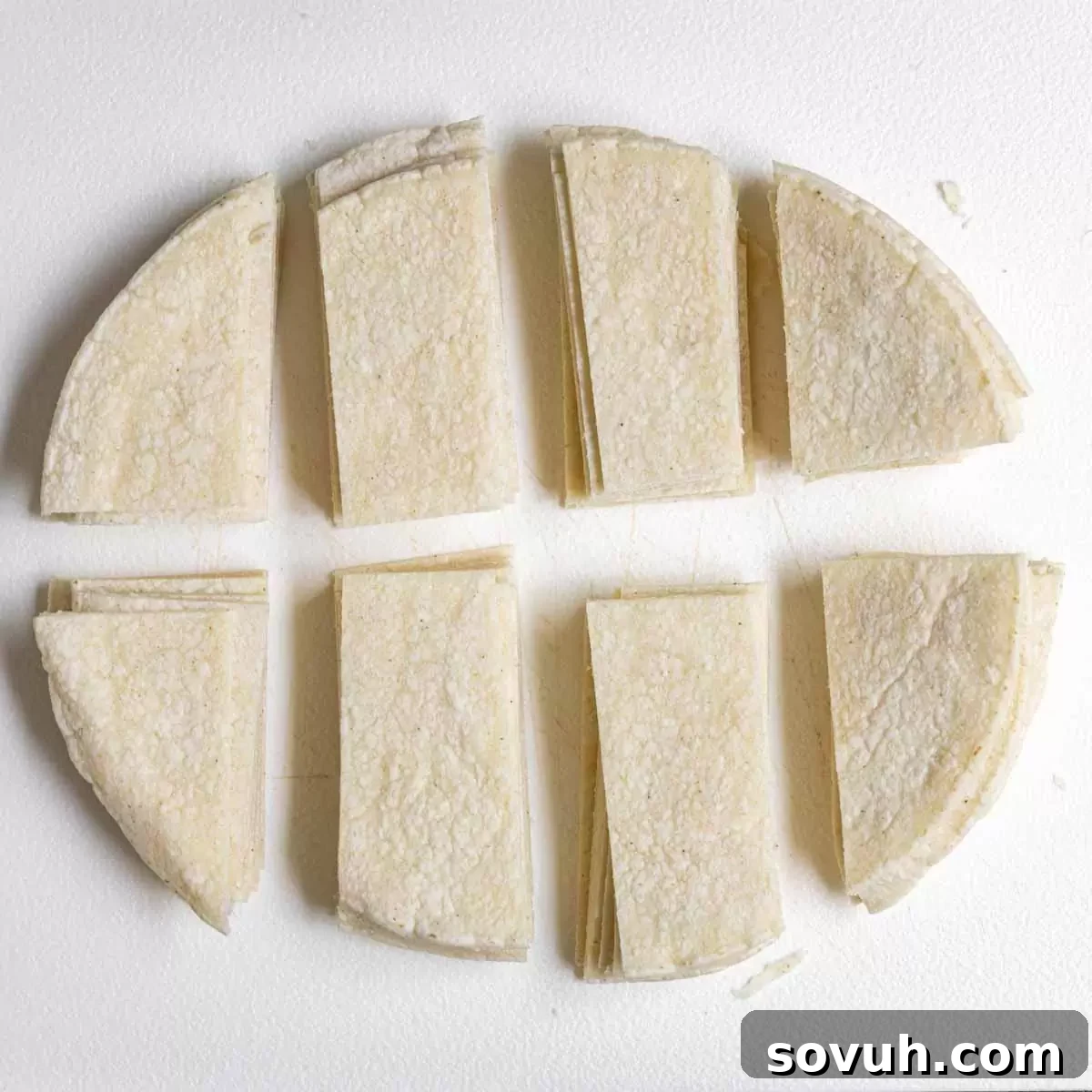 tortillas cut for Crock Pot Chicken Enchiladas