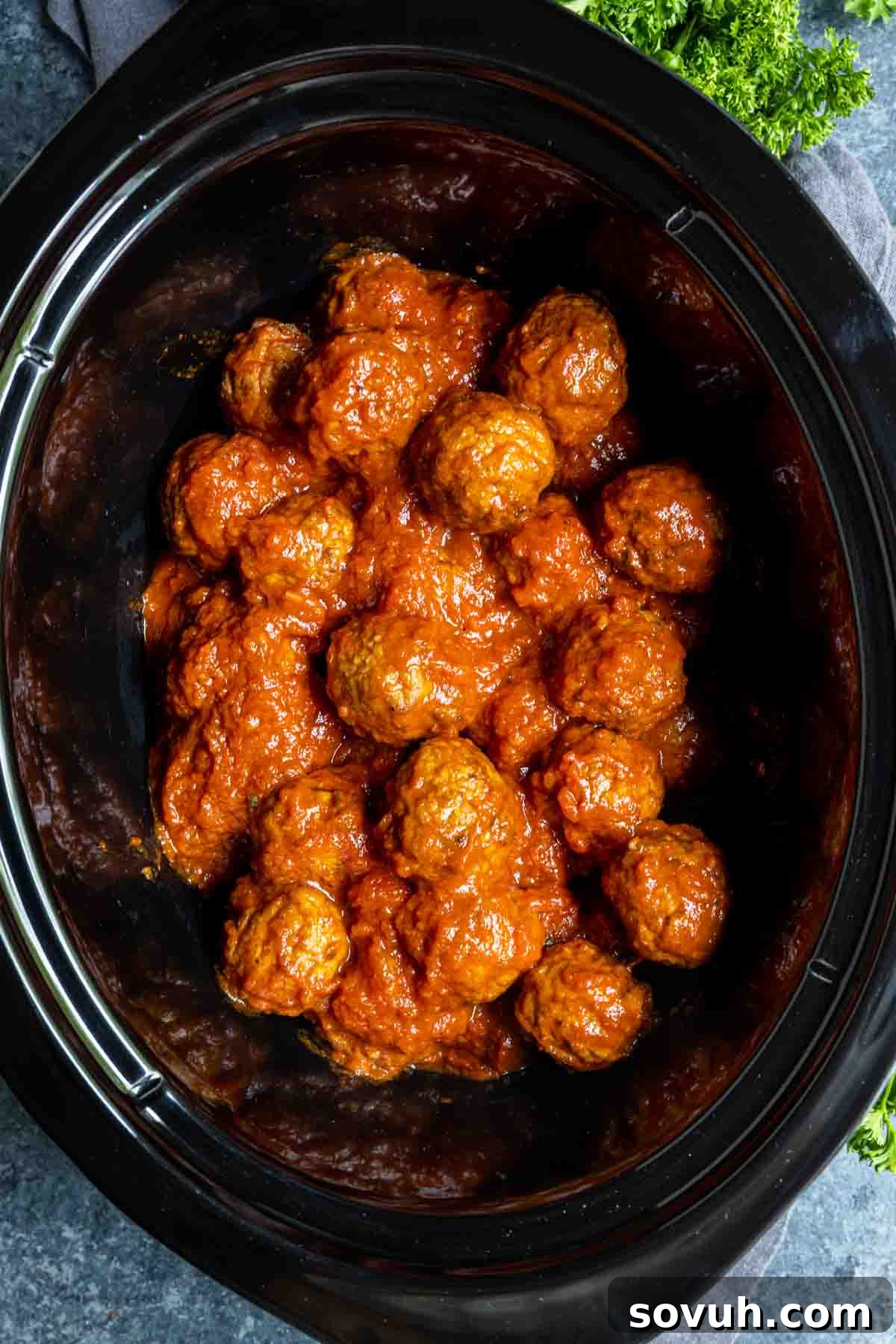 Cooking frozen meatballs in a black slow cooker