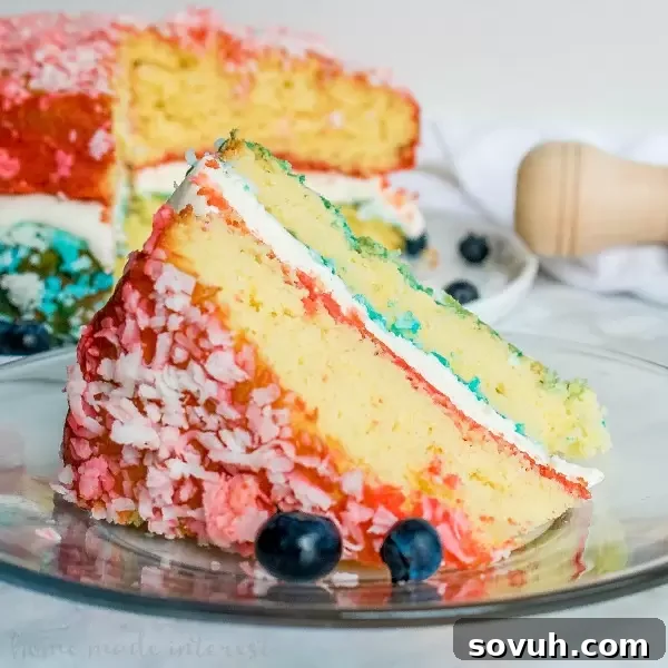 A vibrant Red, White, and Blue Zinger Cake, covered in shredded coconut and filled with marshmallow cream, making it a perfect patriotic dessert.