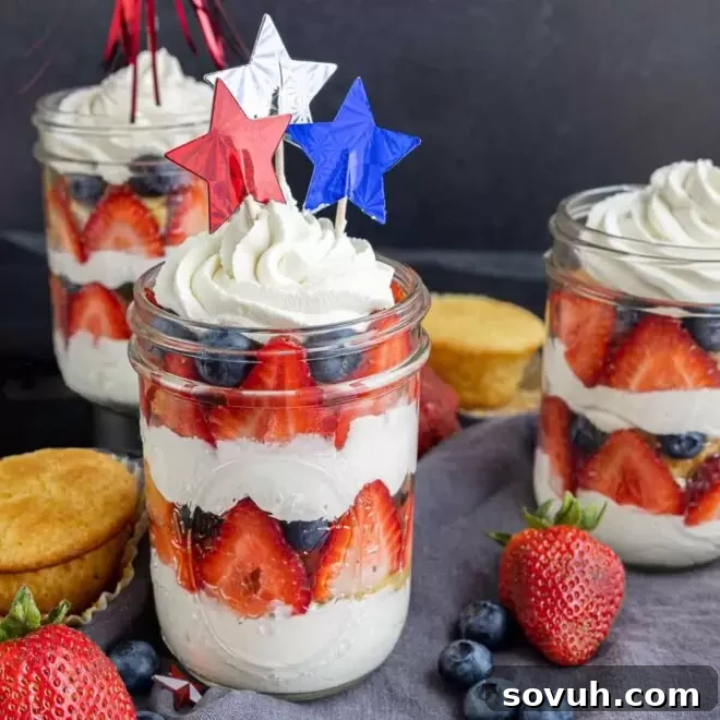 Charming 4th of July Cupcakes in a Jar, layered with fresh fruit and fluffy whipped cream.