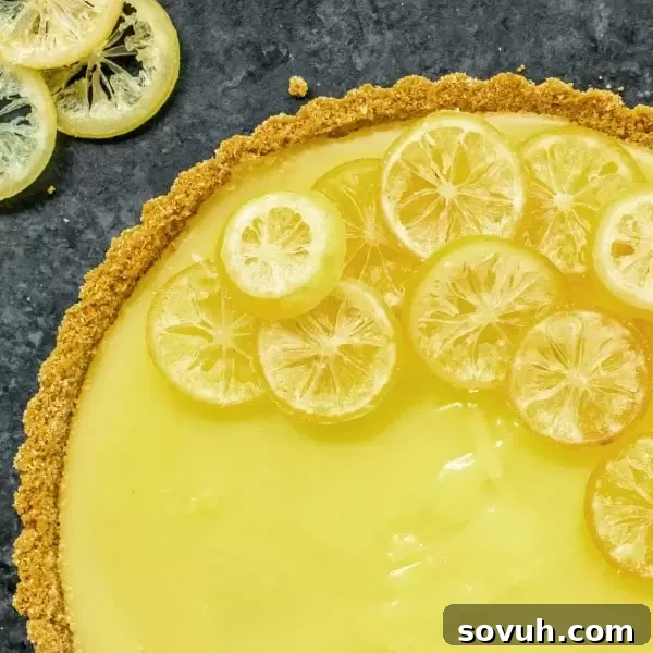 A vibrant Lemon Tart, beautifully presented, offering a sweet and tart delight.
