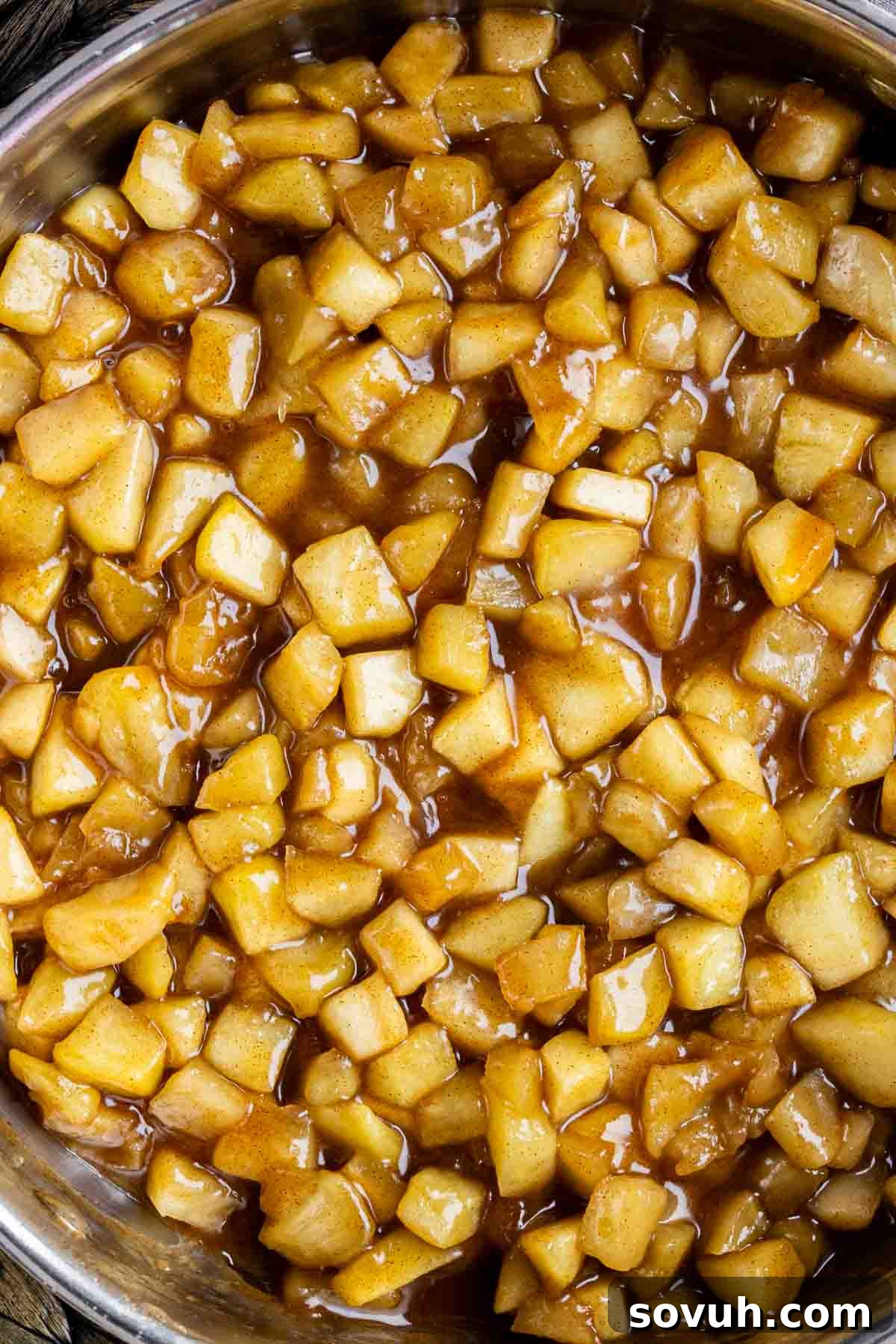 A large pot filled with freshly made apple pie filling, ready for use or storage.