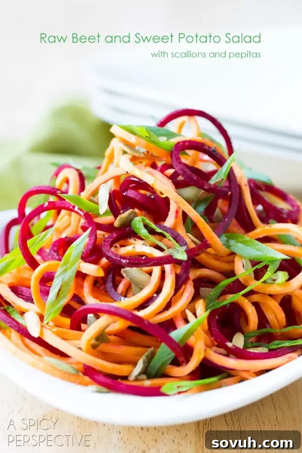 A vibrant display of freshly spiralized vegetables, including zucchini, carrots, and beets, ready for diverse healthy cooking applications.