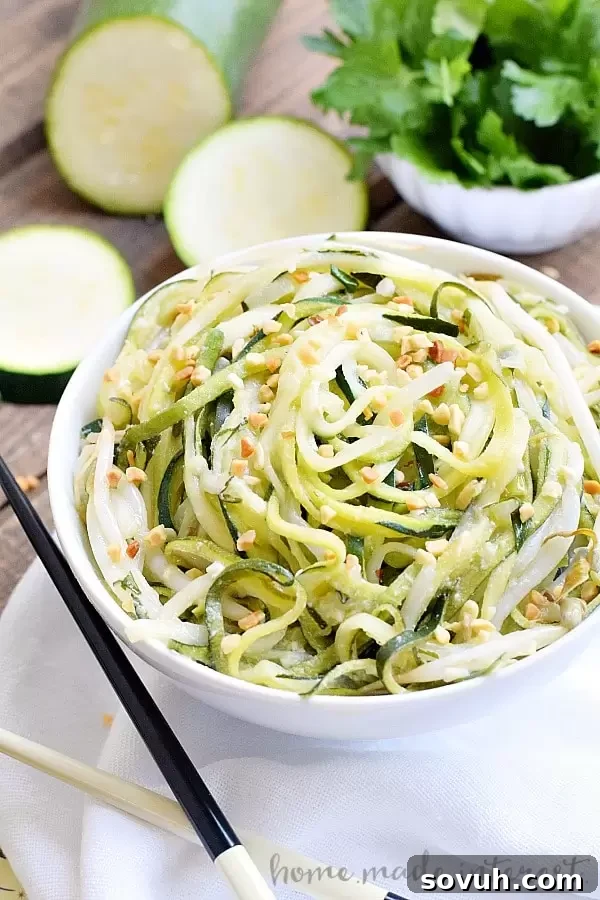 Perfectly golden and crispy baked curly fries, made from spiralized potatoes, presenting a healthier and delicious alternative for snacking.