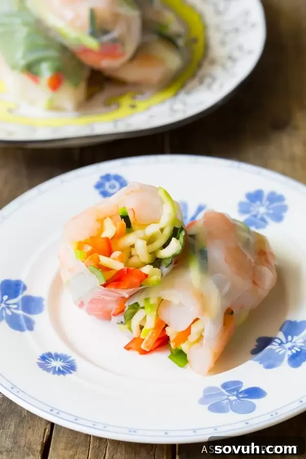 A light and refreshing spiralized apple and cabbage slaw, perfect for a healthy side dish at any outdoor gathering.