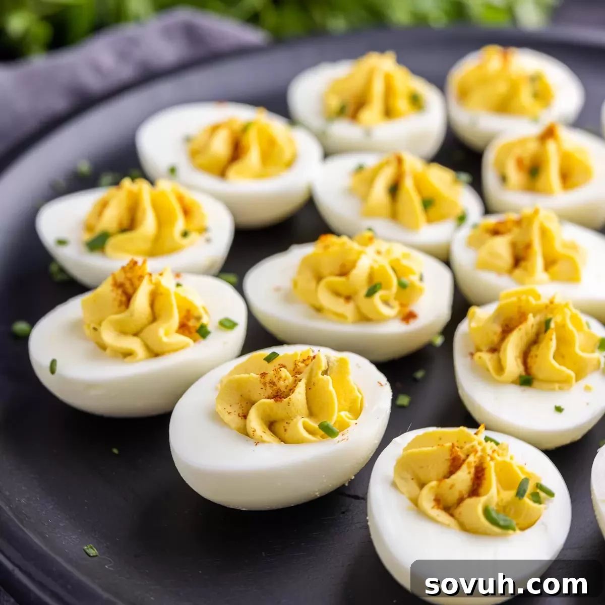 Mastering the Potluck: Unforgettable Dishes for Any Gathering 7 Southern Deviled Eggs on a black platter