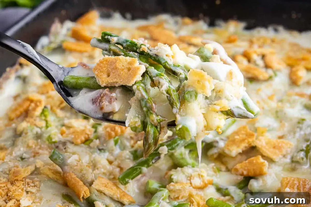 A classic asparagus casserole with creamy sauce, bacon, and cheese.