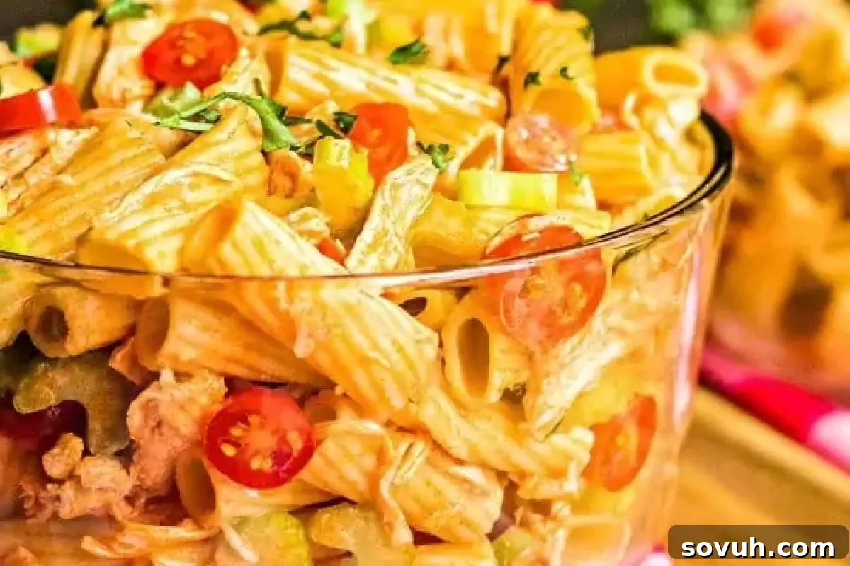 Zesty Buffalo Chicken Pasta Salad with shredded chicken, celery, and a creamy dressing