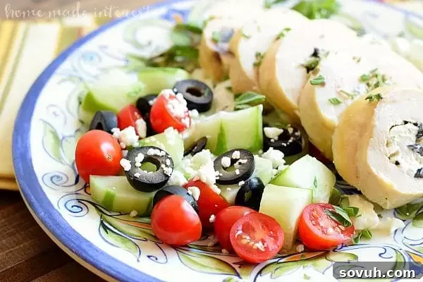 Side view of a Greek Chicken Roll-Up, showcasing the delicious filling, a favorite easy dinner recipe.