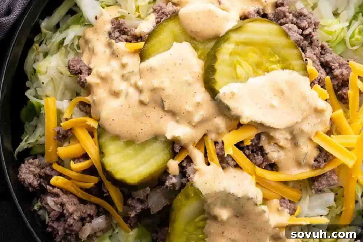 A creamy, orange-hued sauce in a small serving dish, perfect for dipping or dressing.