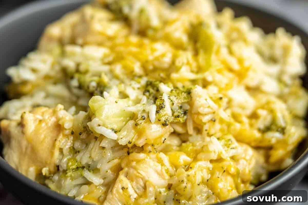 A close-up shot of a creamy and cheesy Instant Pot chicken and rice casserole with tender broccoli florets, creating a comforting and wholesome meal.